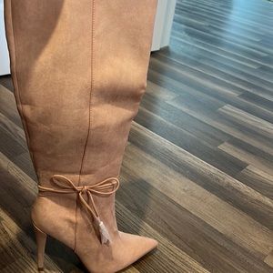 Brand new! Make a statement with these gorgeous boots!